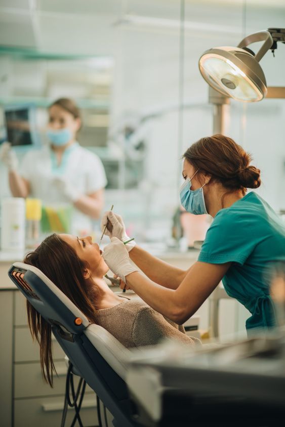 Dentist treating a patient in a modern clinic