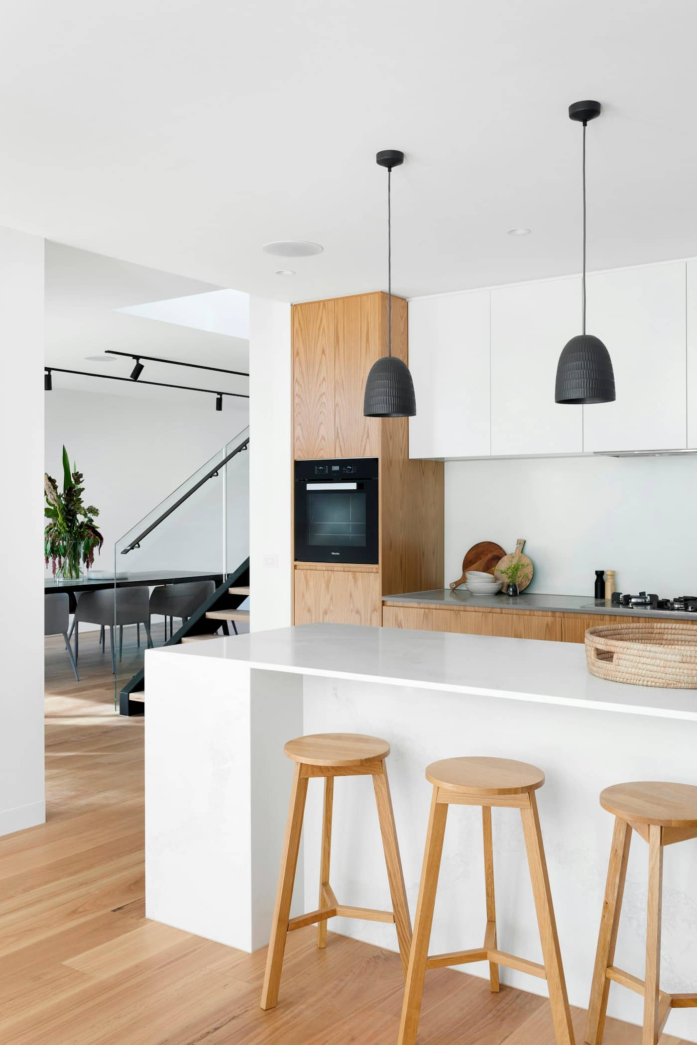 Renovated kitchen and dining space with oak joinery and black stair